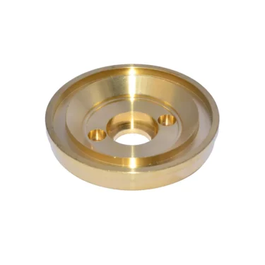 The Isomac 000803 Lower Shower Holder is a round, gold-colored metal disc with a raised outer edge, central hole, and two smaller holes symmetrically placed—perfect for securing shower components. © 2025 1st-line.com
