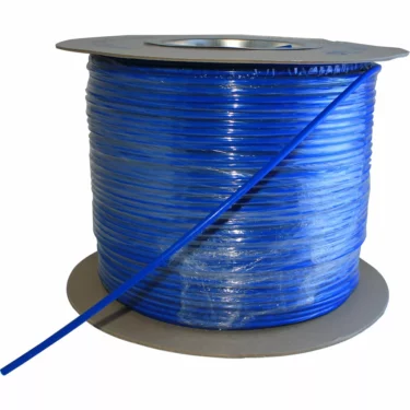 A length of JG 1/4 Polyethylene Tubing Blue / Per. Foot is coiled around a cardboard reel, with one end extending outward from the roll. © 2025 1st-line.com