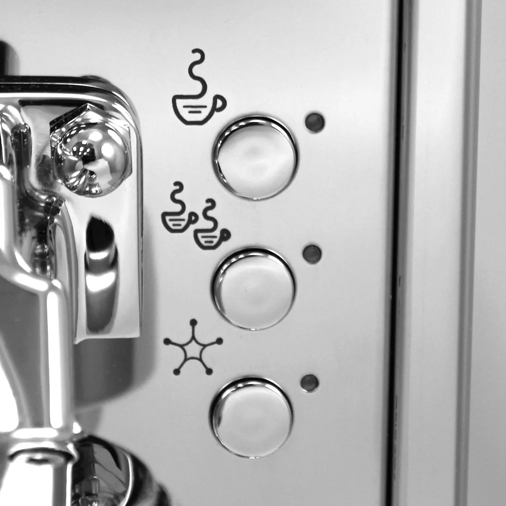 Close-up of three round buttons on the DISCONTINUED Bezzera BZ07 DE PID Electronic Espresso Machine, each with a cup icon for various coffee sizes. Its shiny metallic finish emphasizes the stylish PID-controlled design. © 2025 1st-line.com