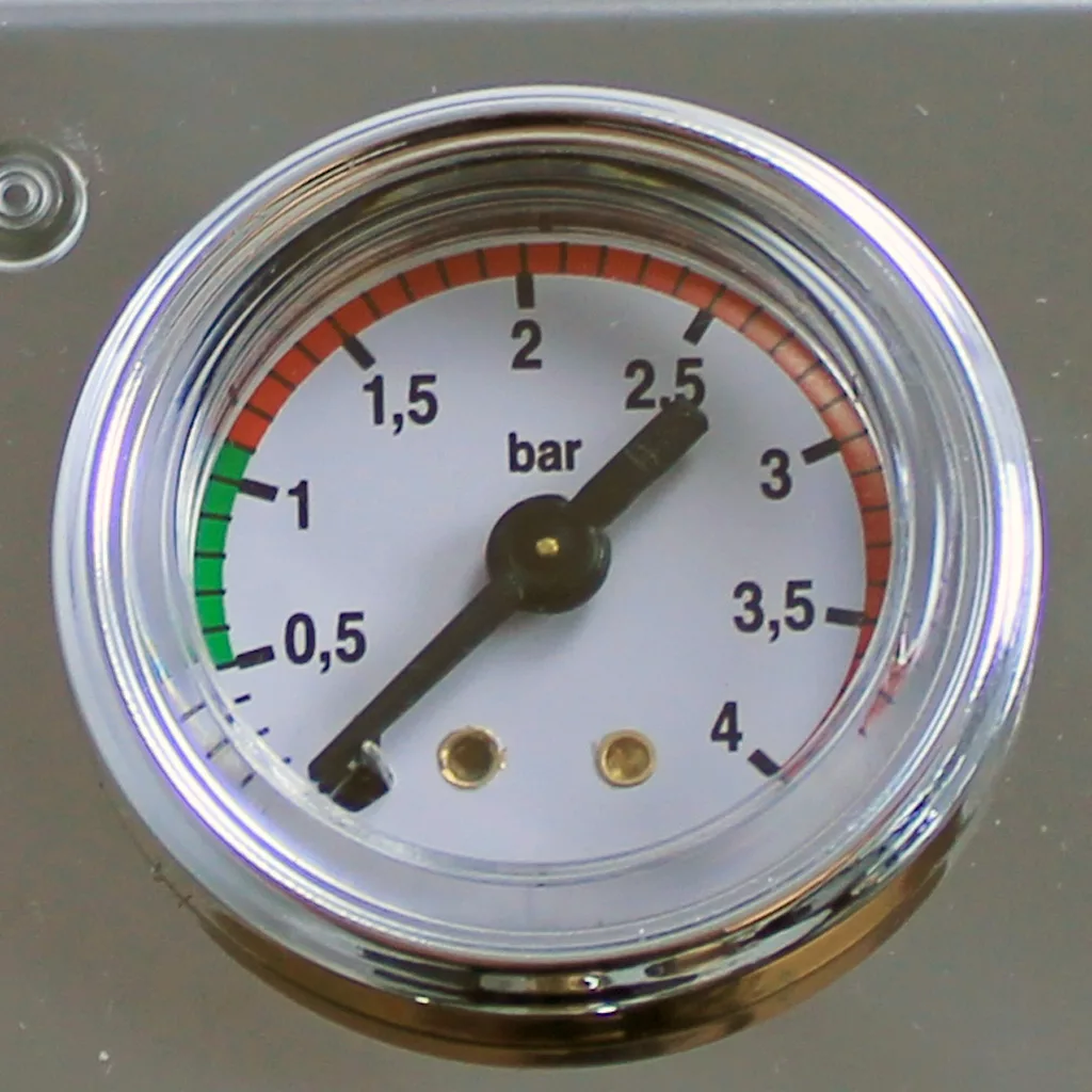A close-up of a pressure gauge on the discontinued VBM Domobar Super V4 Dual Boiler PID Switchable Espresso Machine shows 0–4 bar, with green, yellow, and red zones; the needle rests slightly above 2.5 bar. © 2025 1st-line.com