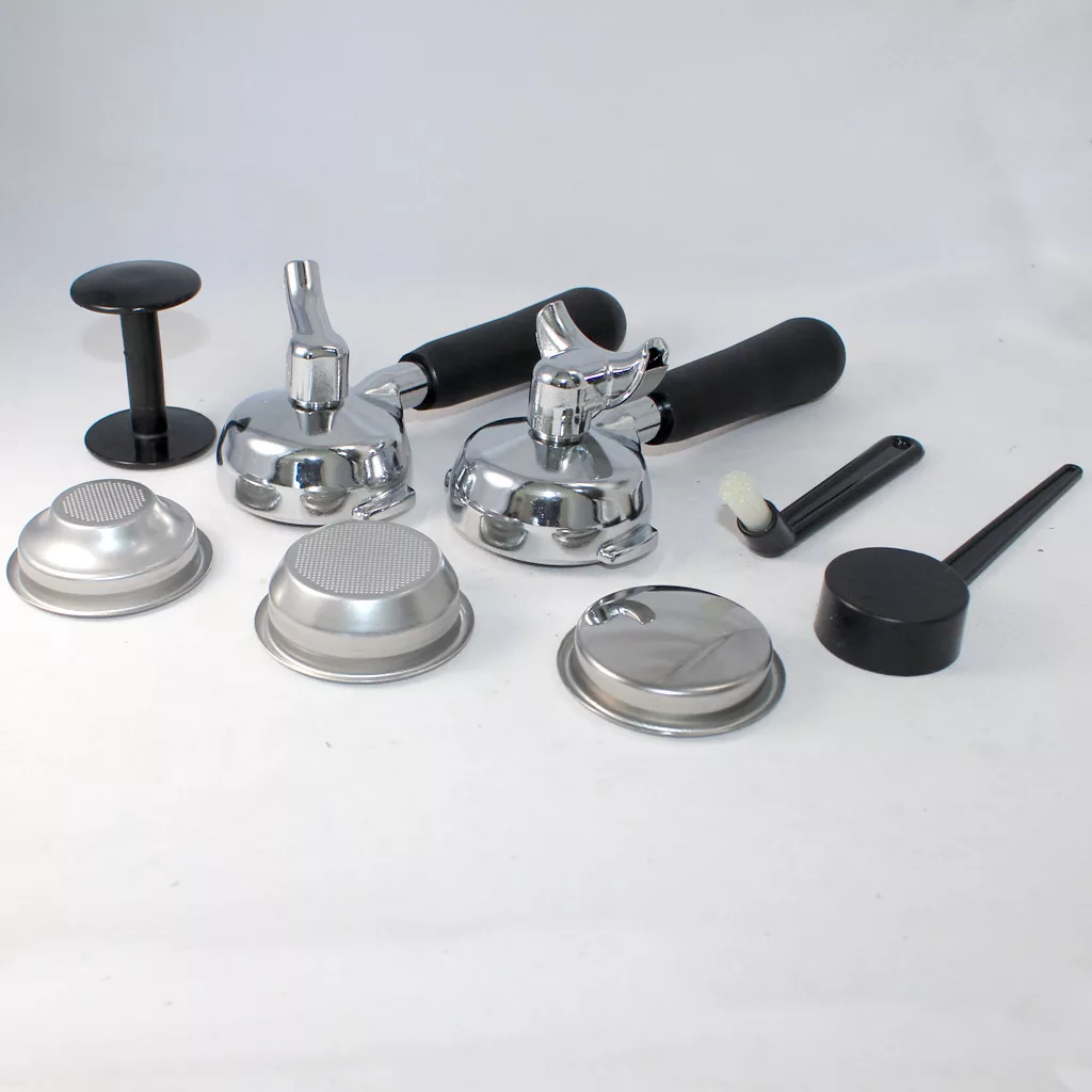 A set of accessories for the DISCONTINUED VBM Domobar Super V4 Dual Boiler PID Switchable Espresso Machine, including two portafilters, filter baskets, a tamper, cleaning brush, and black dosing tool on a white background. © 2025 1st-line.com