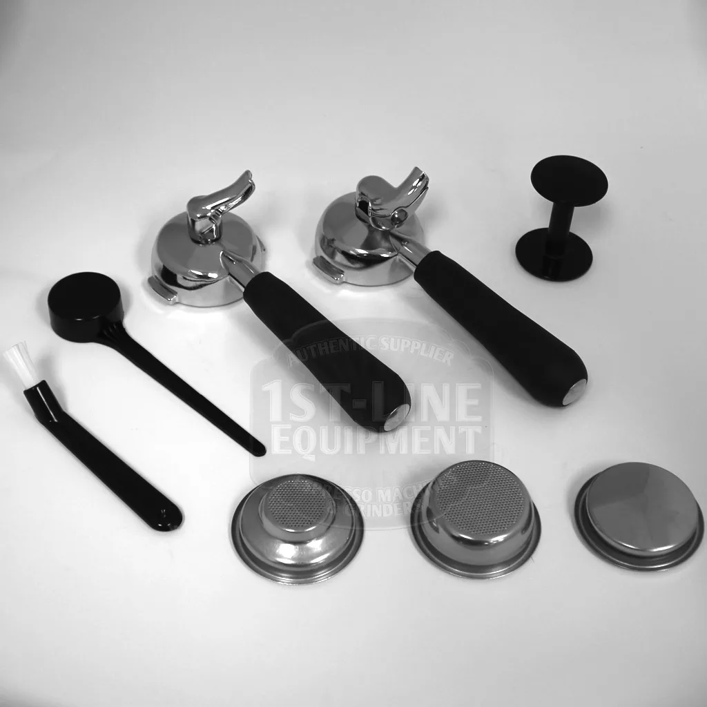 Black and white image of accessories for the DISCONTINUED VBM Domobar Super Switchable HX Espresso Machine - Rotary Pump, including two portafilters, a tamper, brush, scoop, and three metal filter baskets on a white background. © 2025 1st-line.com