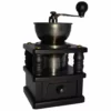 The Hario Roman N Hand Coffee Grinder features a metal bowl and crank on top, a black wooden base, and a small bottom drawer to collect ground coffee. © 2025 1st-line.com
