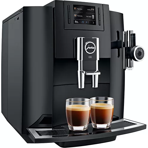 A DISCONTINUED Jura E8 Super-Automatic Coffee Machine in sleek black with digital display dispenses two espresso shots into clear glass cups. © 2025 1st-line.com