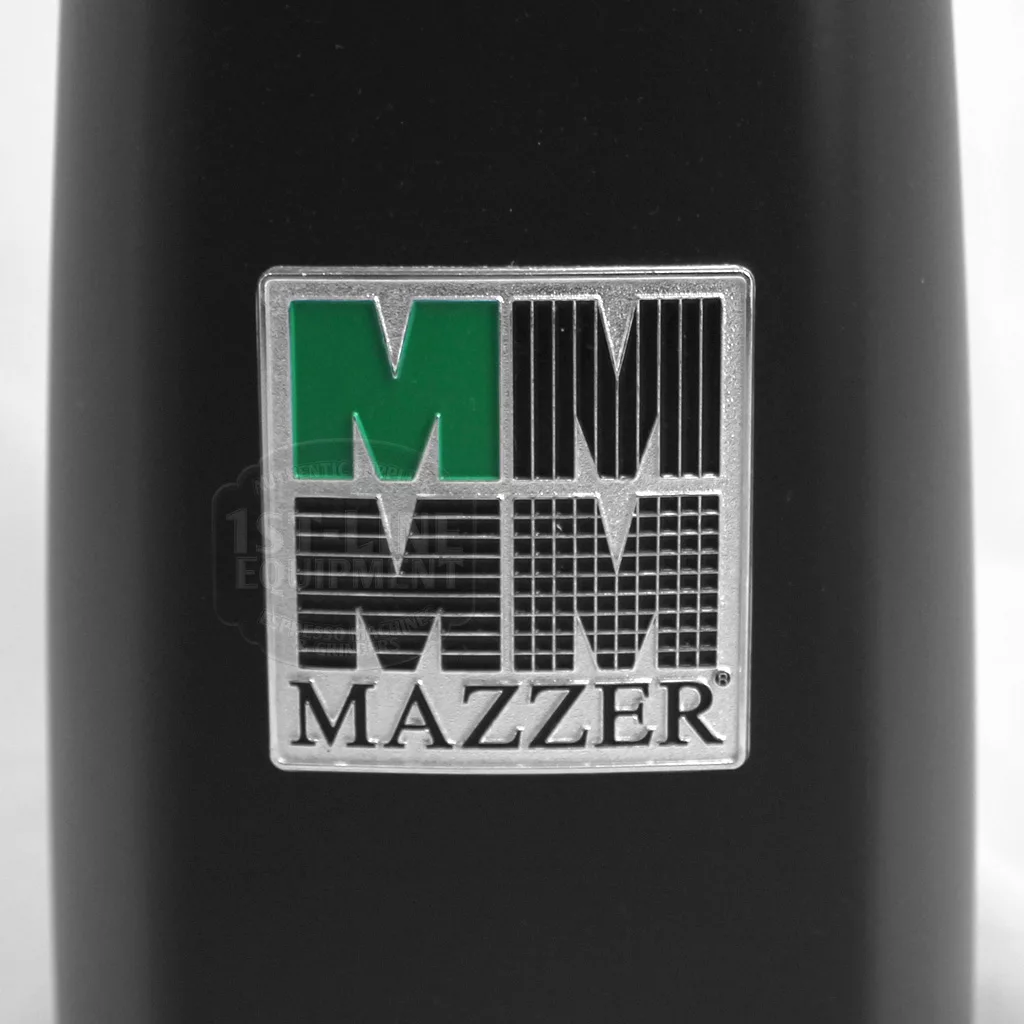 Close-up of a metallic logo with three stylized M’s—one green, two black—above Mazzer on black, signature of the DISCONTINUED Mazzer Mini Type A Espresso Coffee Grinder (old style). © 2025 1st-line.com
