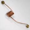The Lelit MC526 Capillary for Double Manometer, with a central copper tube and brass fittings at each end, lies on a white surface. Its tightly wound copper coil stretches straight out from both sides. © 2025 1st-line.com