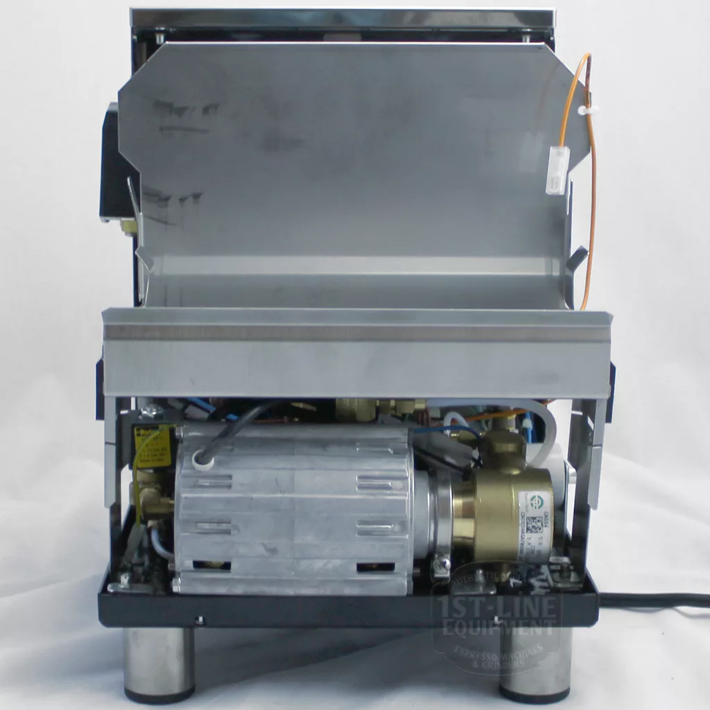 A DISCONTINUED Bezzera Mitica V2 HX Switchable Espresso Machine with its back panel removed reveals internal components like the motor, wiring, and metal frame, set against a white background. © 2025 1st-line.com