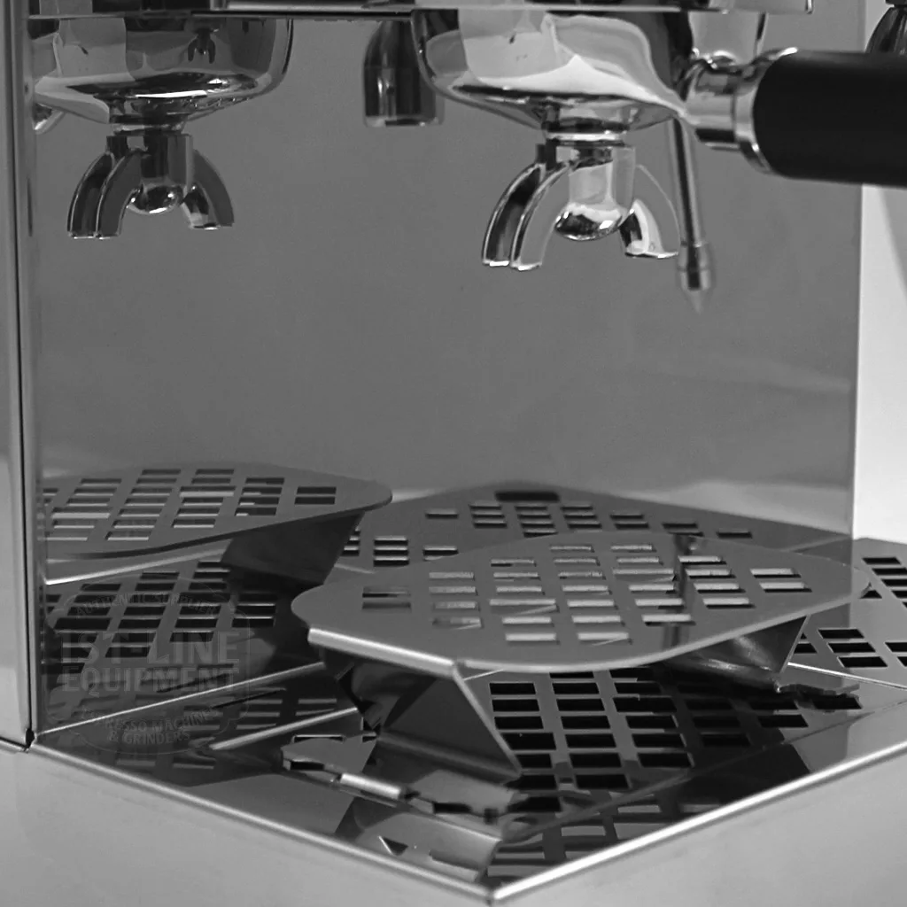 Black and white close-up of the discontinued Lelit PL60PLUST Diana PID Dual Boiler Espresso Machine, showcasing its dual group heads, metal drip tray, and advanced PID control reflecting light on the glossy surface. © 2025 1st-line.com