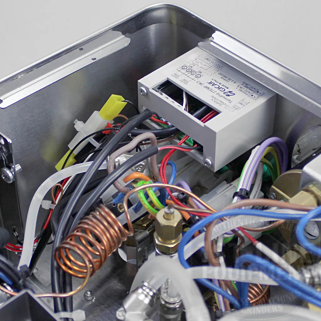 Close-up of the internal wiring and components inside the stainless steel DISCONTINUED Lelit PL60PLUST Diana PID Dual Boiler Espresso Machine, showing copper tubing, colorful wires, a PID controller, and an electronic relay. © 2025 1st-line.com