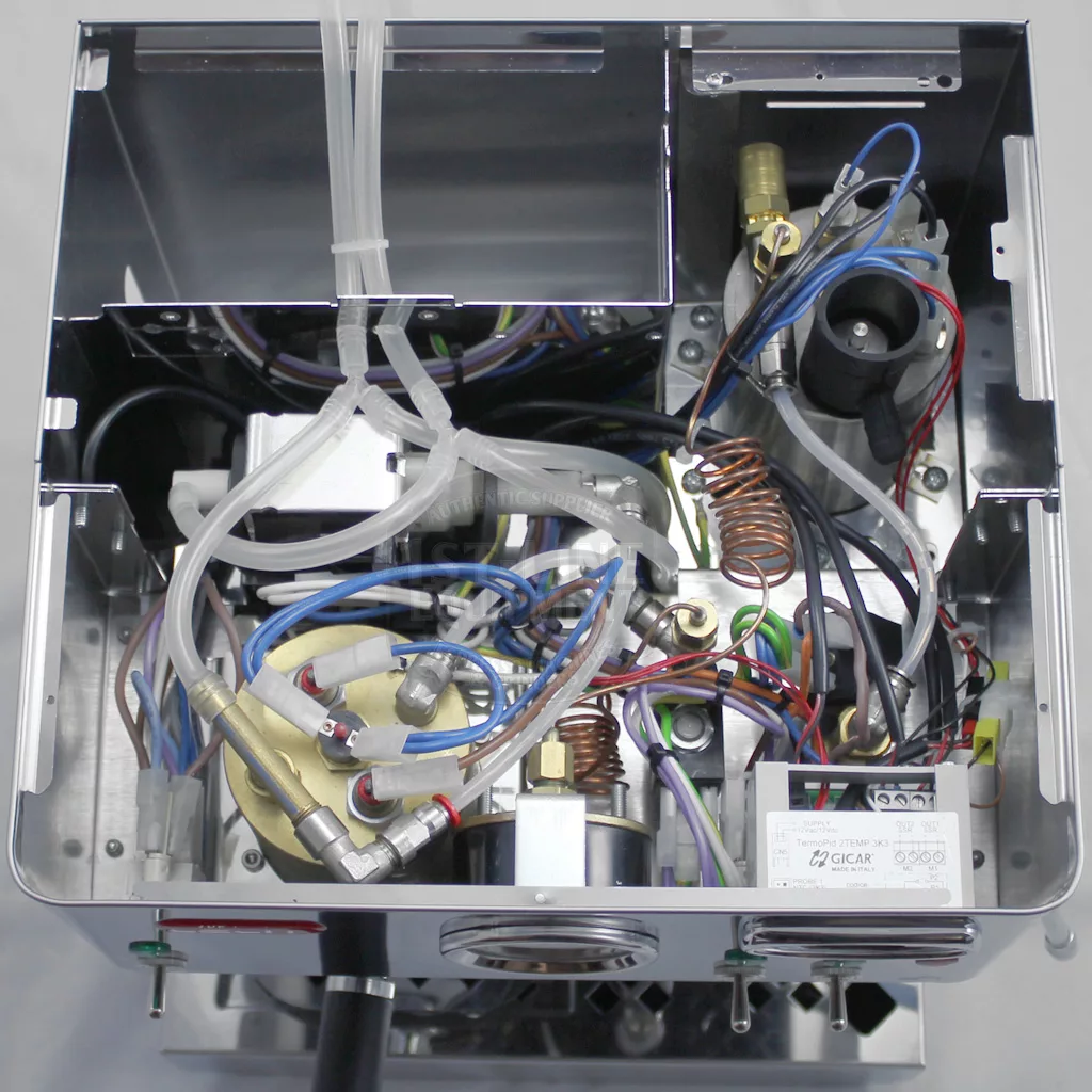 Top-down view of the interior of the DISCONTINUED Lelit PL60PLUST Diana PID Dual Boiler Espresso Machine, showing tubes, wires, metal components, and electronics in a compact, intricate layout. © 2025 1st-line.com