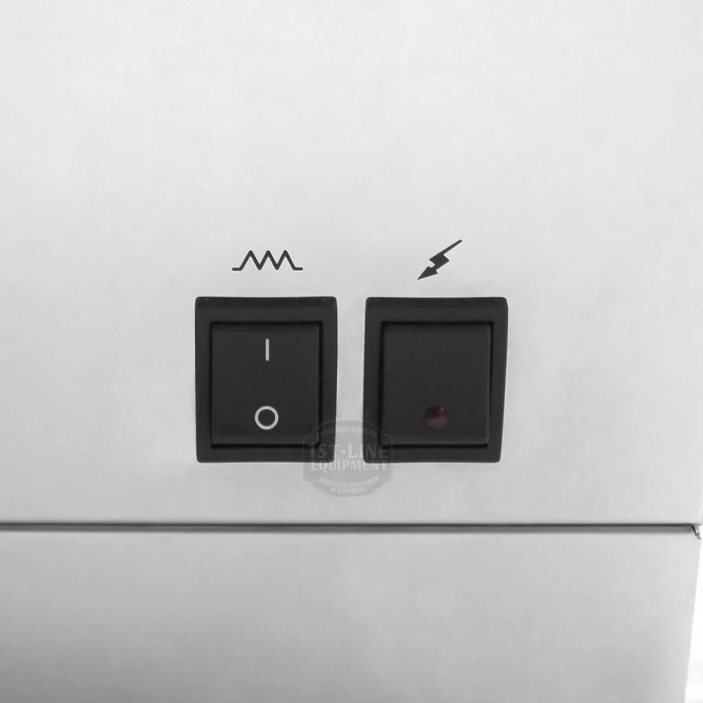 Two black switches on the white panel of the discontinued Lelit PL60PLUST Diana PID Dual Boiler Espresso Machine: the left has wavy line and I/O symbols, and the right features a lightning bolt plus a red indicator light. © 2025 1st-line.com