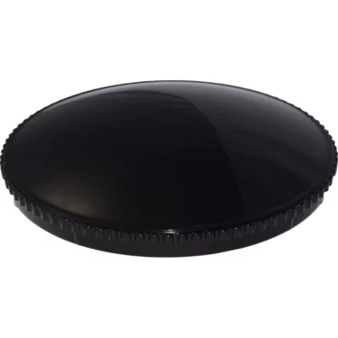 The Quamar 160078 Doser Cover - T48 is a black, round plastic lid with a slightly domed top and textured edges, displayed against a white background. © 2025 1st-line.com