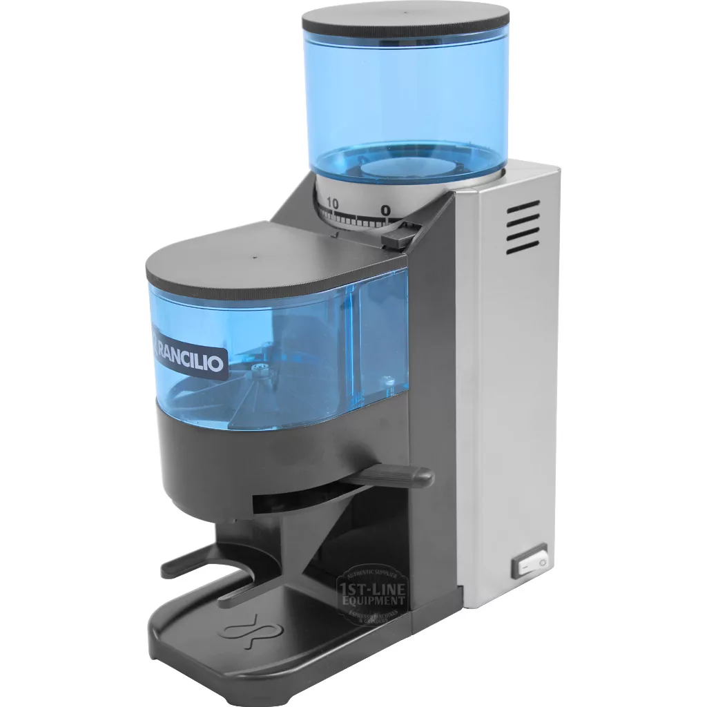 The DISCONTINUED Rancilio Rocky Doser V3 Espresso Coffee Grinder features a silver and black design, blue-tinted bean hopper, adjustable grind dial, ground coffee container, and front portafilter holder for precise performance. © 2025 1st-line.com