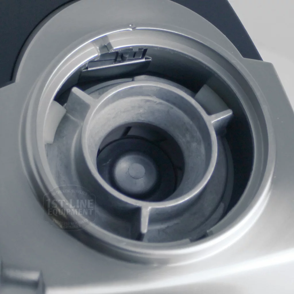 Close-up of the DISCONTINUED Baratza Vario Coffee Grinder’s burr chamber, showing its metal components and grooves in a gray and silver color scheme. This model is recognized for its precise grinding mechanism. © 2025 1st-line.com