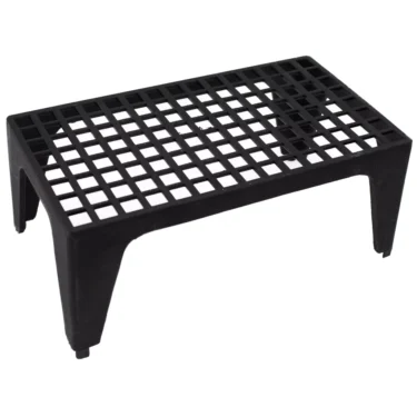 A black plastic riser with a rectangular grid top and four legs, used to elevate the Rancilio S20/H Leave Cup or its parts for better air circulation or drainage. © 2025 1st-line.com