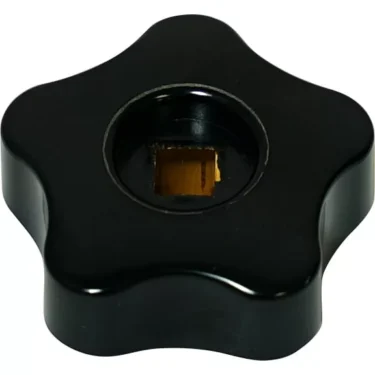 A black, star-shaped Isomac 000216 Steam Knob with a central square brass insert, shown from above on a white background. © 2025 1st-line.com