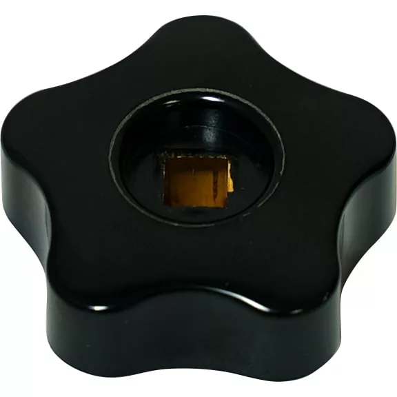 A black, star-shaped Isomac 000216 Steam Knob with a central square brass insert, shown from above on a white background. © 2025 1st-line.com
