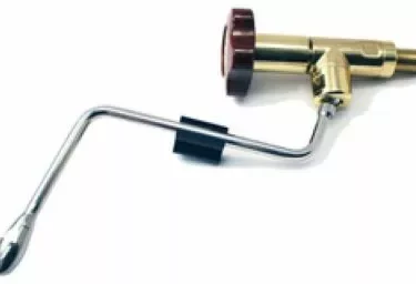 A brass gas torch with a red control knob and curved metal nozzle, featuring a finish like the Elektra 00690038 Steam Valve Polished Brass/Brierwood Bakelite, is commonly used for welding or soldering. © 2025 1st-line.com