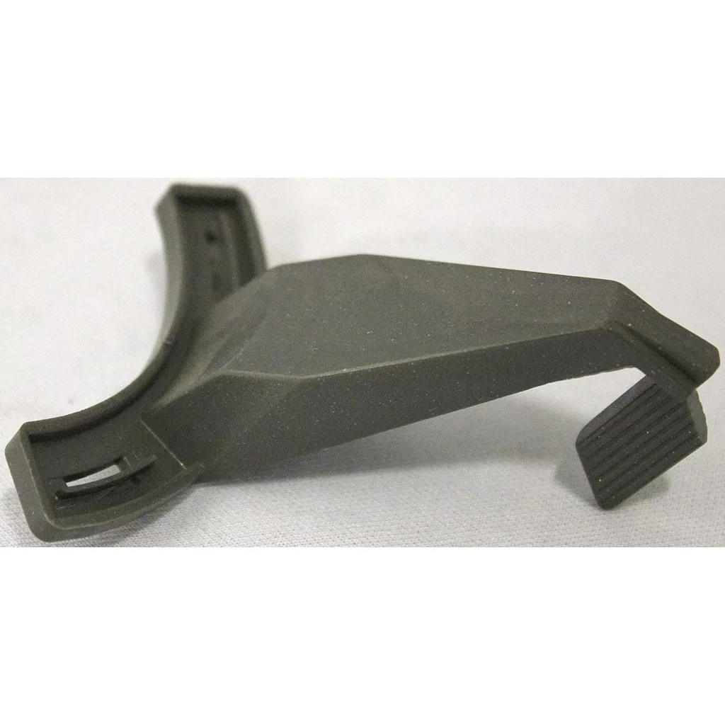 A close-up of a Saeco Lever for Grinder Adjustment on Royal/Magic Machines—black, angular plastic with a curved base and ribbed flat protrusion—rests on a light gray surface. © 2025 1st-line.com