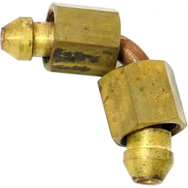 A close-up of the Bezzera 5162296LL Boiler Load Pipe shows a brass compression elbow fitting with two hexagonal nuts and a short bent copper tube connecting the ends, ideal for plumbing or mechanical use. © 2025 1st-line.com