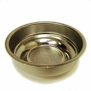 A close-up of the Elektra 00720035 57mm 1-Cup Filter Basket, featuring small holes at the bottom for espresso machines, is shown on a white background. © 2025 1st-line.com
