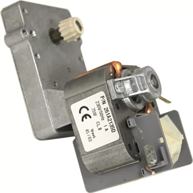 A close-up of the Fiorenzato A1900064 Motor - 230V - Accademia showcases its metal gear, metallic housing, attached label with model info, and visible copper wire coils. © 2025 1st-line.com