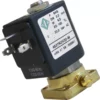 A close-up of the Fiorenzato A1900068 Solenoid Valve for Hot Water - 230-240V shows its black and metallic body, technical label, electrical connectors, and brass mounting base. © 2025 1st-line.com