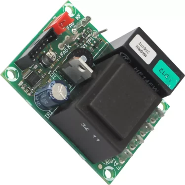 A close-up of the Macap Mainboard - 110V - M2 featuring a blue cylindrical capacitor, black relay, green terminal blocks, and other components mounted on its green circuit board. © 2025 1st-line.com