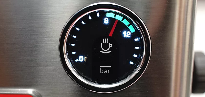 A close-up of the pressure gauge on the DISCONTINUED Lelit Victoria PL91T PID Single Boiler Espresso Machine shows a cup icon, bar readings, and the needle at about 9 bars in a green-highlighted section. © 2025 1st-line.com