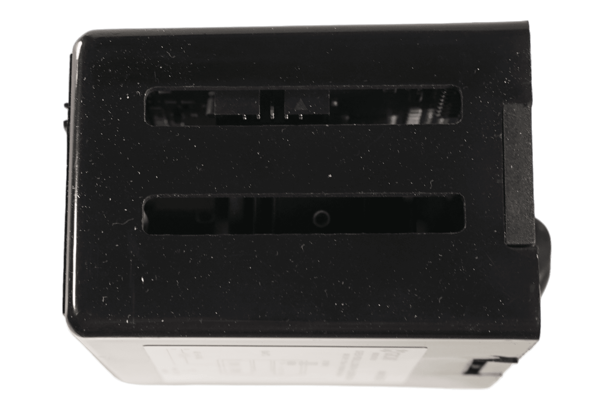 A close-up of the top of a black Gicar ELETDOSPIDDS12015 Brain Unit - 9.9.37.40G, 115V for VBM DB V4 2015, showing two horizontal slots that reveal some internal components. © 2025 1st-line.com