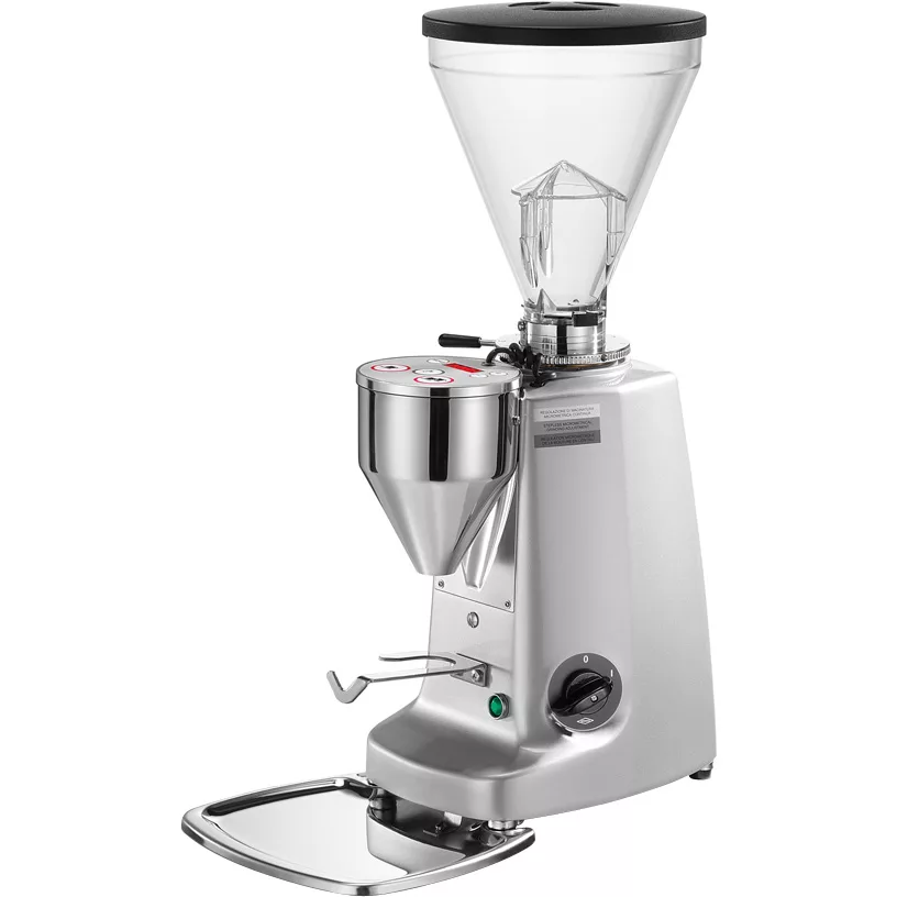 A discontinued Mazzer Super Jolly Electronic Stepless Doserless Espresso Coffee Grinder in silver, featuring a large clear bean hopper, front control buttons, and a metal portafilter holder, displayed on a white background. © 2025 1st-line.com