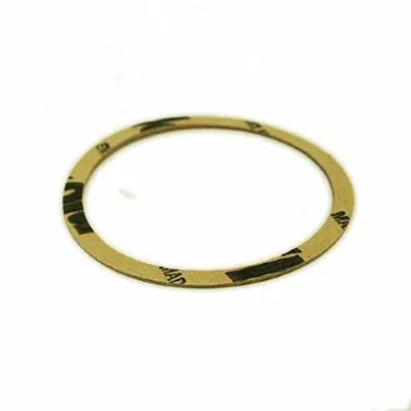 A Fiorenzato A1200047 Portafilter/Grouphead paper shim spacer, thin and flat with a light brown color and black printed text, is shown on a white background. © 2025 1st-line.com