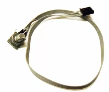 A gray ribbon cable has a black connector on one end and a Macap C0006M104 M4D Switch on the other. © 2025 1st-line.com