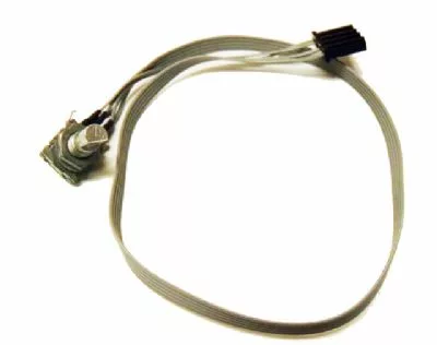 A gray ribbon cable has a black connector on one end and a Macap C0006M104 M4D Switch on the other. © 2025 1st-line.com