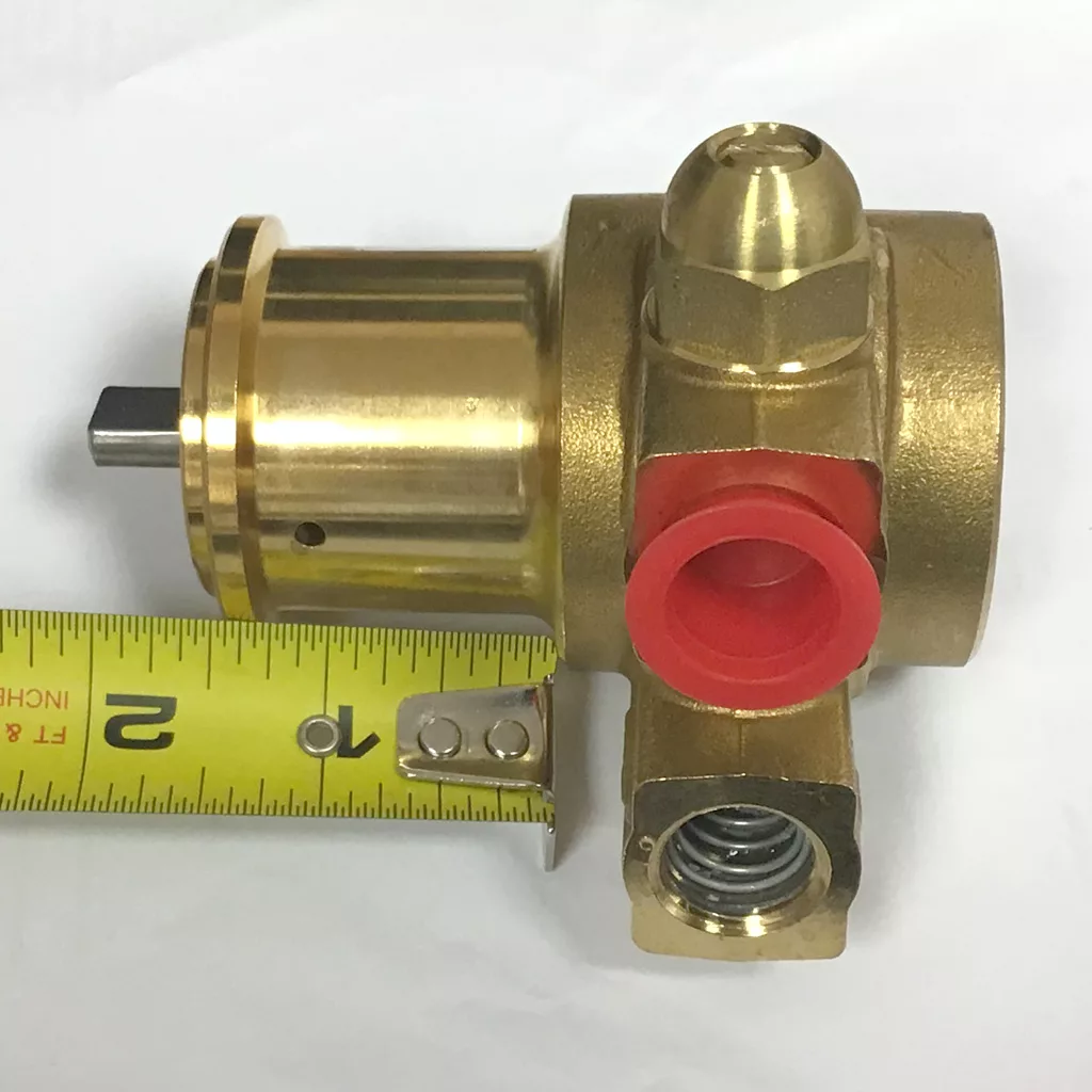 A Procon Rotary Vane Pump and Bracket with a brass valve featuring a red port and exposed spring is displayed on a white surface beside a yellow tape measure showing it is about 2.5 inches long. © 2025 1st-line.com