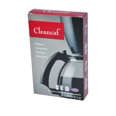 A red and gray box of Urnex CleanCaf Cleaner for home coffee and espresso machines, displaying a glass coffee pot image and multilingual text on the front. © 2025 1st-line.com