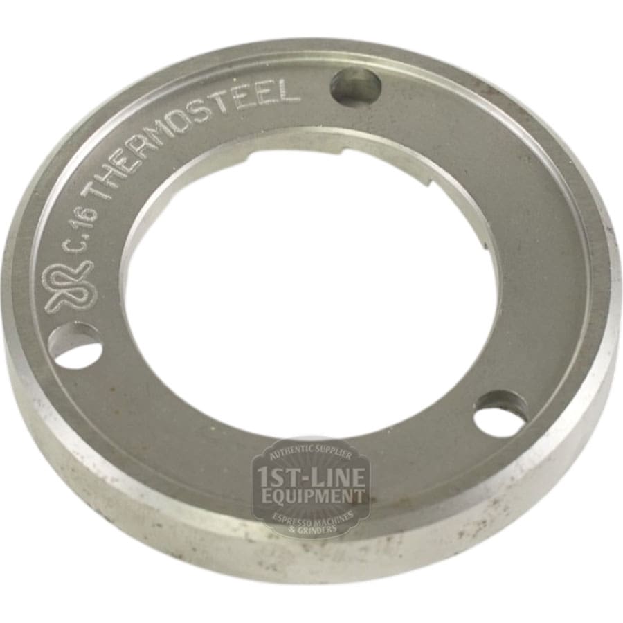 A round metal piece with three holes and C.16 THERMOSTEEL engraved, featuring a notched 64mm center—resembles the Rancilio 69000306 64mm Single Flat Grinding Burr used in Rancilio coffee grinders. © 2025 1st-line.com