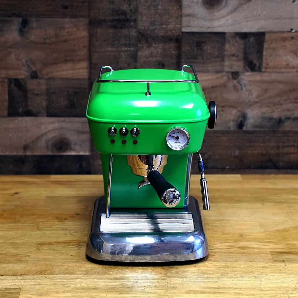 A (SOLD) SIDEWALK SALE - Ascaso Dream V1 UP Meadow Green Espresso Machine Tank/Reservoir (USED), featuring silver accents, steam wand, gauge, and control switches, sits on a wooden countertop with a matching background. © 2025 1st-line.com