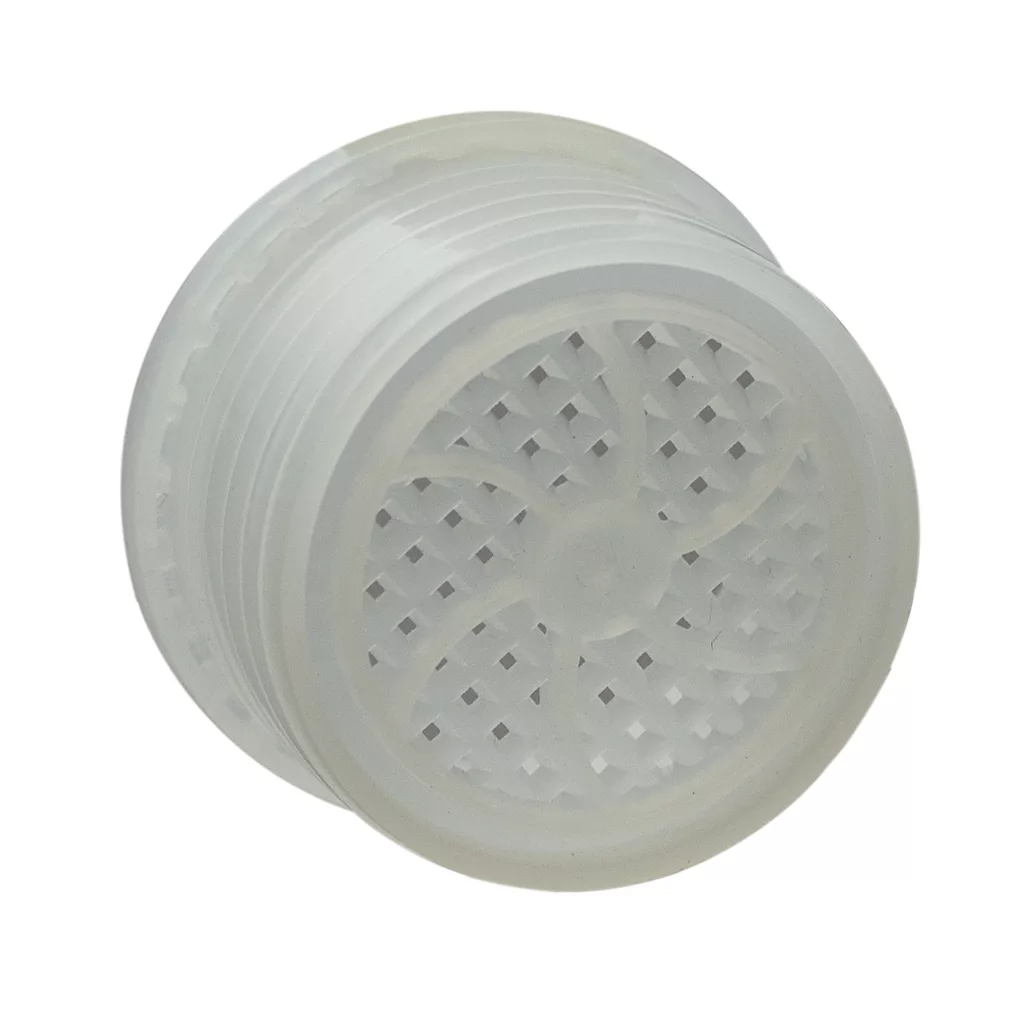 A translucent plastic herb grinder with ridged sides and a gridded top, perfect for prepping herbs before using your Ascaso I.2567 Cleaning Capsule. © 2025 1st-line.com