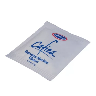 A white packet labeled Urnex Espresso Cleaner for Backflushing Sample Packet (1/4 oz, 7g), designed for cleaning and backflushing espresso machines, is shown on a plain white background. © 2025 1st-line.com