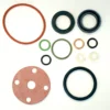 Assorted gaskets, O-rings, washers, and seals from the Elektra 01930034 Gasket Kit in various sizes, shapes, and colors are arranged neatly on a white background. © 2025 1st-line.com