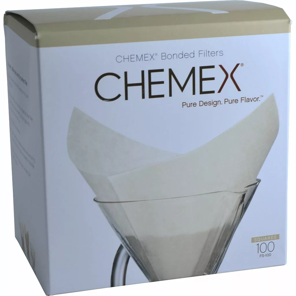 Chemex FS-100 Prefolded Square Coffee Filters, 100 count, shown in a Chemex coffee maker. The packaging highlights 100 filters and the slogans “Pure Design. Pure Flavor.”. © 2025 1st-line.com