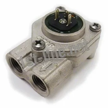 Close-up of a Bezzera 7431001 Flowmeter - Gicar 9.0.96.02G, showing two threaded pipe inlets, two bolts, and a three-prong electrical connector on top; the metallic surface features a 1st-line.net watermark. © 2025 1st-line.com