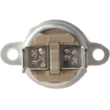 Close-up of a Lelit MC521 Manual Resettable Safety Thermostat featuring two metal mounting tabs and connection terminals, with labeling on the surface showing numbers and patent information. © 2025 1st-line.com