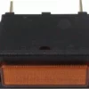 Close-up of a rectangular orange Rancilio 34030063 Indicator Light for Silvia, featuring two metal prongs for connections and enclosed in a black plastic casing. © 2025 1st-line.com