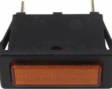 Close-up of a rectangular orange Rancilio 34030063 Indicator Light for Silvia, featuring two metal prongs for connections and enclosed in a black plastic casing. © 2025 1st-line.com