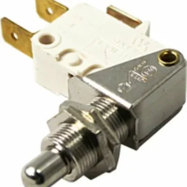 Close-up of a VBM ELETMICREKIRI Microswitch, featuring a metal and plastic push-button, threaded shaft with hex nut, two brass terminals, and a white housing stamped with specification details. © 2025 1st-line.com