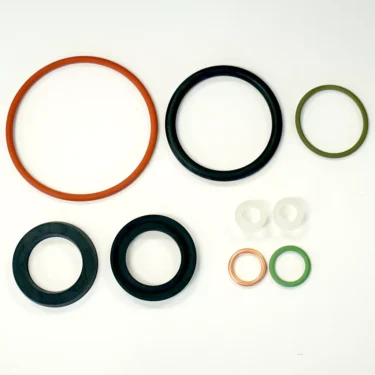 Elektra 03156034 Gasket Kit O-rings and washers in assorted sizes and colors—orange, black, green, copper, and white—are displayed on a white background. © 2025 1st-line.com