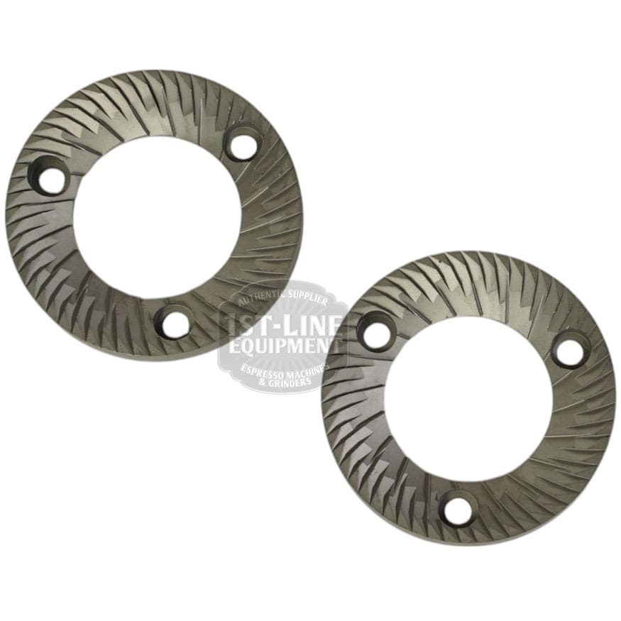 Mazzer FMA00182D/QQQ 1-phase 58mm Flat Grinding Burrs (set of 2) with angled grooves and three round holes each are shown against a white background. Suitable as grinding components for coffee grinders. © 2025 1st-line.com