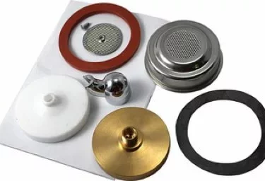 Parts from the Elektra 03382034 Pod Kit for Nivola, like metal filters, rubber gaskets, and a brass disk, are displayed on a white surface in assorted colors and circular shapes. © 2025 1st-line.com
